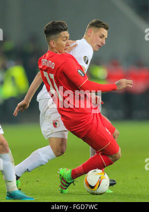 Augsburg, Germany. 18th February, 2016. Roberto FIRMINO, LIV 11 in action against Dominik KOHR, FCA 21   during the UEFA Europa League Round of 32: First Leg match FC Augsburg - Liverpool 0-0 on February 18, 2016 in Augsburg, Germany. Credit:  Peter Schatz / Alamy Live News Stock Photo