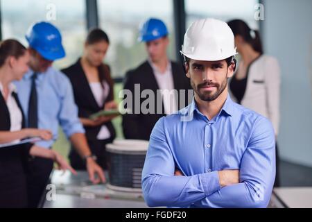 business people and engineers on meeting Stock Photo