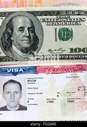 The American visa on page of the Russian international passport and US dollars Stock Photo