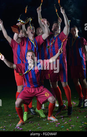 soccer players celebrating victory Stock Photo