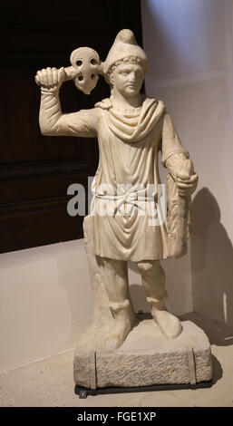 The Roman cult of Mithras. Mithra genius carrying torch and double ax. Marble. Louvre Museum. Paris. France. Stock Photo