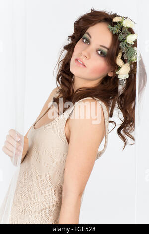 Young woman with flower arrangement as a headdress