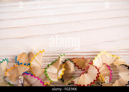 Bunch of pencil shavings on light wooden background Stock Photo