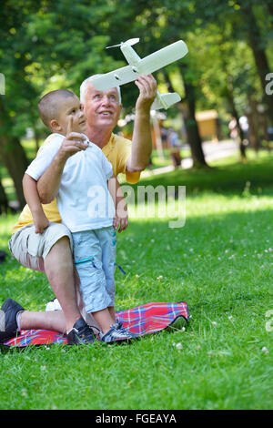 happy grandfather and child in park Stock Photo
