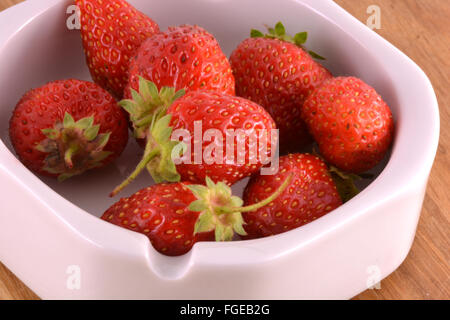 Fresh ripe strawberries on a vintage wooden background Stock Photo