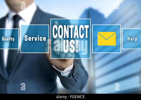 contact us touchscreen is operated by businessman. Stock Photo