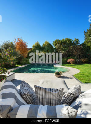 Architecture; beautiful garden with pool, view from the armchair Stock Photo