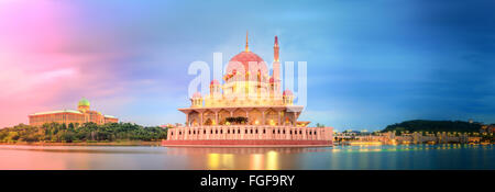 Sunset over Putrajaya Mosque and Panorama of Kuala Lumpur, Malaysia. Stock Photo