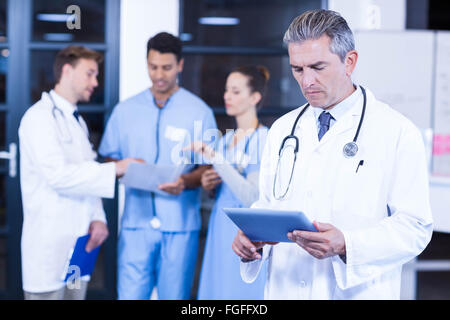 Doctor using tablet in hospital Stock Photo