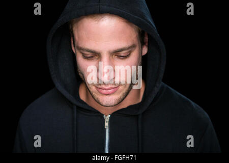 Handsome man wearing a black hoodie Stock Photo