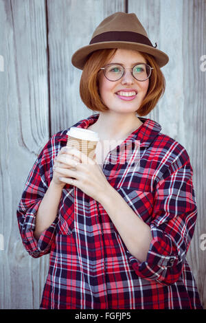 smiling hipster woman holding a coffee cup Stock Photo