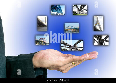 Pictures of various buildings on the hands of businesses represents success. Stock Photo