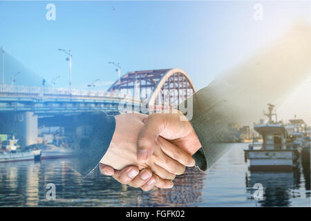 Business men and women shaking hands with each other to work together. Stock Photo