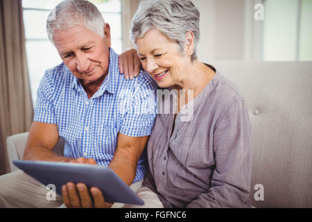 Senior couple looking at digital tablet Stock Photo
