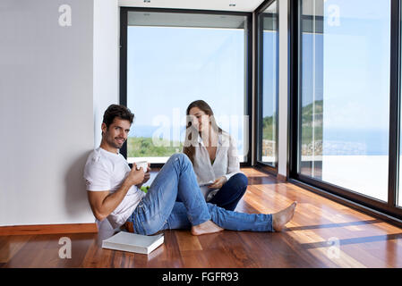 relaxed young couple at home staircase Stock Photo