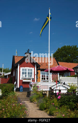 Traditional Swedish red summer house in Brandaholm, Dragso Island, Karlskrona, Blekinge, South Sweden, Sweden, Scandinavia Stock Photo