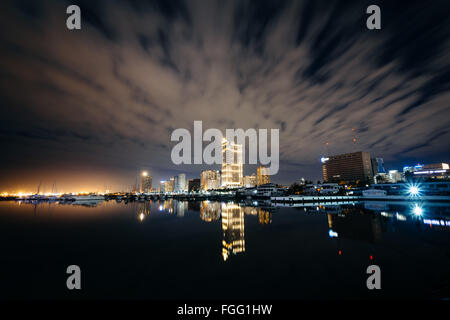 Manila Bay at night, seen from Harbour Square, in Pasay, Metro Manila, The Philippines. Stock Photo