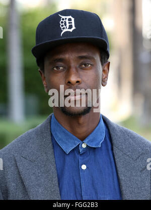 'Twilight' and 'X-Men' actor Edi Gathegi seen engrossed in a phone call while out in Beverly Hills, and then joined by his girlfriend Courtney B. Turk  Featuring: Edi Gathegi Where: Los Angeles, California, United States When: 15 Jan 2016 Stock Photo