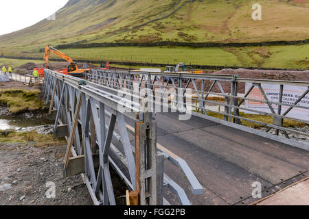 Temporary bridging spanning two becks at Dunmail Riase, Thirlmere in the Lake District, Cumbria. Road built after A591 damaged Stock Photo