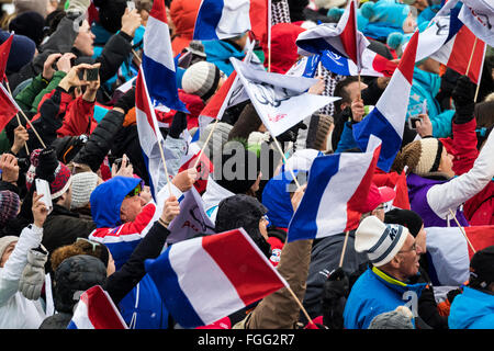 Chamonix, France. 19th February, 2016. Fans react to the arrival of Alexis Pinterault at the finish of the men's downhill course in Chamonix. The Men's Alpine Combined event (downhill and slalom) ended with the downhill section of the race last due to weather conditions (heavy snow) earlier in Chamonix. The race began at 15.15h on a shortened course after a further hour of delay. The podium was - 1- PINTURAULT Alexis (FRA) 2:13.29 2- PARIS Dominik (ITA) 2:13.56 3-MERMILLOD BLONDIN Thomas (FRA) 2:13. Credit:  Genyphyr Novak/Alamy Live News Stock Photo