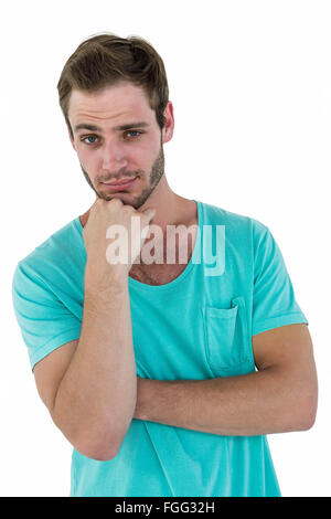 Hipster man posing with hand on chin Stock Photo