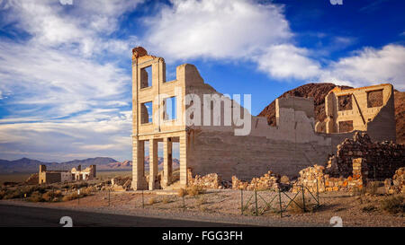 Ruins of the Rhyolite ghost town bank near Death Valley Stock Photo