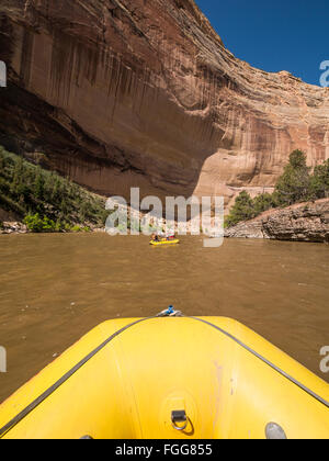 Boats beneath the Grand Overhang, Yampa River, Dinosaur National Monument, Colorado. Stock Photo