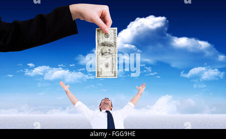 Composite image of businesswomans hand holding hundred dollar bill Stock Photo