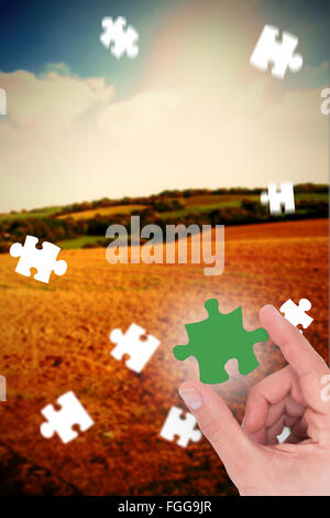 Composite image of businessman measuring something with his fingers Stock Photo