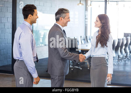 Business team interacting in office Stock Photo