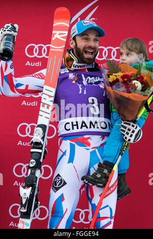 Chamonix, France. 19th February, 2016. - Thomas Mermillod Blondin - 3rd place on the podium, with his son. The Men's Alpine Combined event (downhill and slalom) ended with the downhill section of the race last due to weather conditions (heavy snow) earlier in Chamonix. The race began at 15.15h on a shortened course after a further hour of delay. The podium was - 1- PINTURAULT Alexis (FRA) 2:13.29 2- PARIS Dominik (ITA) 2:13.56 3-MERMILLOD BLONDIN Thomas (FRA) 2:13. Credit:  Genyphyr Novak/Alamy Live News Stock Photo