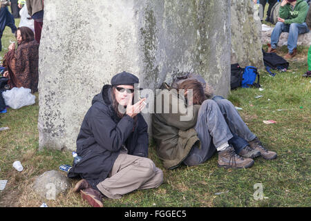 lack of sleep,sleeping,sleep deprived,after,all,night,party,partying,at,Stonehenge,Summer Solstice, sunrise, June,Wiltshire,England,U.K.,UK, Stock Photo