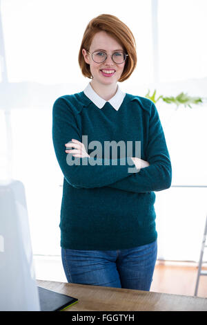 smiling hipster business woman with her arms crossed Stock Photo