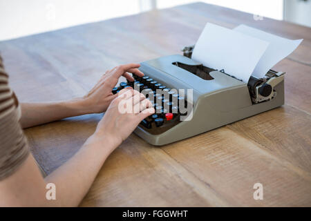 female hands typing on a typewriter Stock Photo