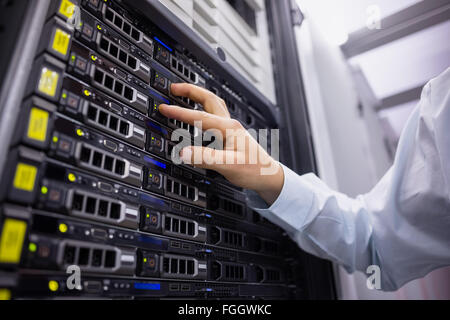 Technician working on server tower Stock Photo
