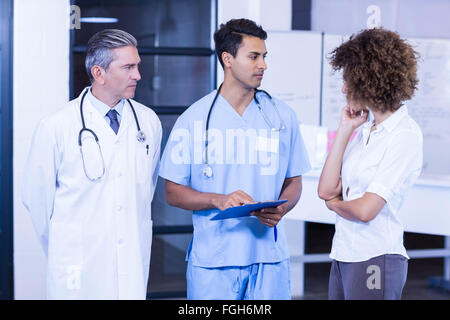 Doctor having a discussion with colleagues Stock Photo