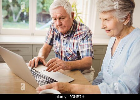 Senior couple checking their bills Stock Photo