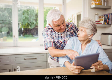 Senior couple using digital tablet Stock Photo