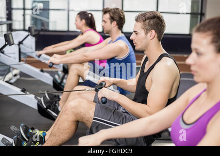 Fit people on drawing machine Stock Photo