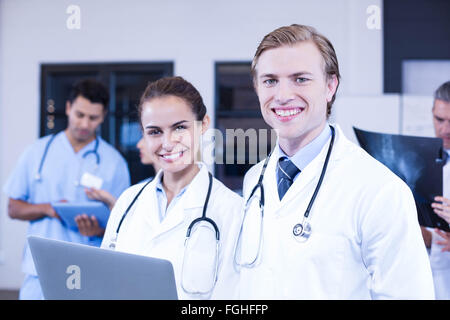 Portrait of doctors using laptop Stock Photo