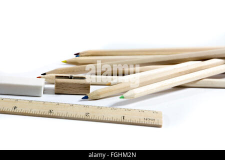pencil, eraser, sharpener, wood meter on white background Stock Photo