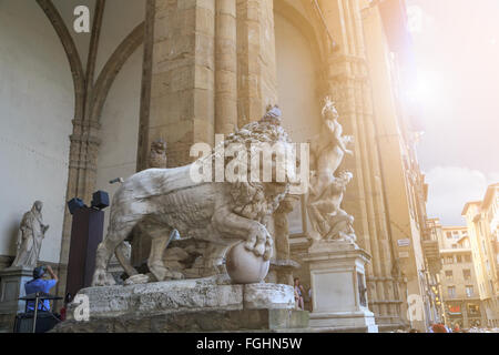 FLORENCE, ITALY - SEPTEMBER 22, 2015 : Close up view of historical granite sculptures of a lion at Piazza Della Signoria. Stock Photo