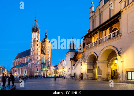 Krakow - Poland - April 22. Krakow - evening picture of old square in Krakow. People walking through the square. Highlighted Kra Stock Photo
