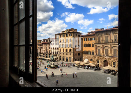 FLORENCE, ITALY - SEPTEMBER 22, 2015 : View of Piazza Della Signoria in Florence, with people and sculptures around. Stock Photo