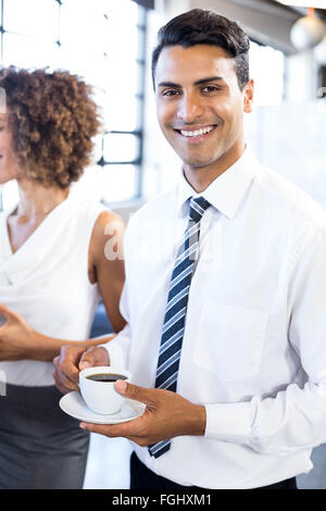 Business executive having a cup of tea Stock Photo