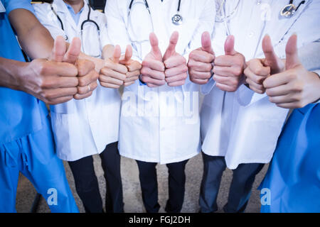Medical team putting their thumbs up Stock Photo