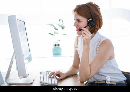 smiling hipster business woman wearing a headset Stock Photo