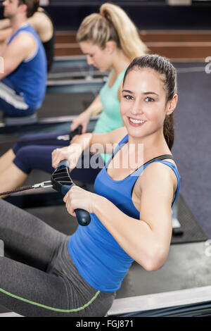 Fit people on drawing machine Stock Photo