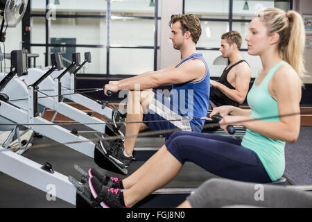 Fit people on drawing machine Stock Photo