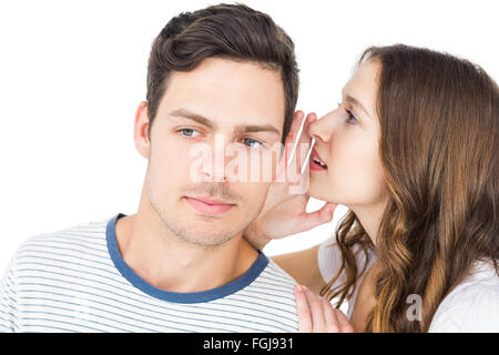 Young couple sharing a secret Stock Photo - Alamy